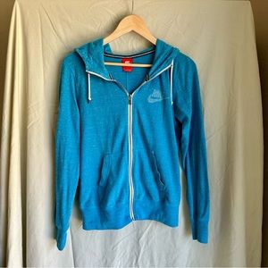 Blue Nike zip up in good condition. Lightweight and perfect for your workout!